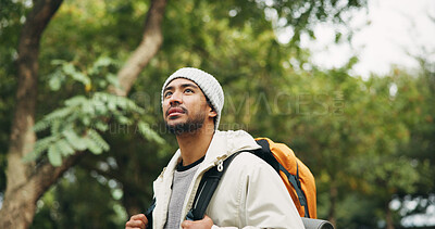 Buy stock photo Thinking, travel and hiking with man in nature for eco tourism, adventure and national park. Sustainability vacation, backpacking and trekking with person outdoor for wellness, vision and explore