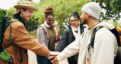 Buy stock photo Hiking, hands stack and people in forest, support and bonding together for reunion. Gesture, group and friends in woods, holiday for trekking adventure or motivation for journey, smile or countryside