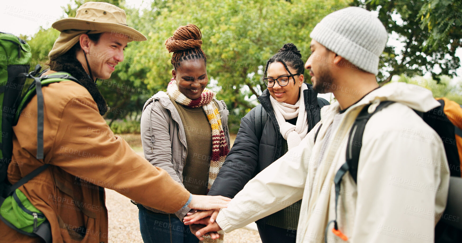 Buy stock photo Hiking, hands stack and people in forest, support and bonding together for reunion. Gesture, group and friends in woods, holiday for trekking adventure or motivation for journey, smile or countryside