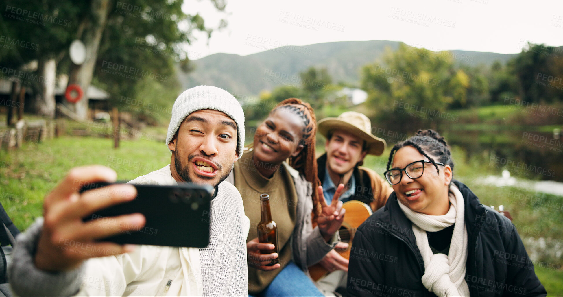 Buy stock photo Selfie, relax and funny face with friends in nature for social media post, beer or profile picture. Holiday, photography memory and vacation with group of people and guitar outdoor for trip and drink