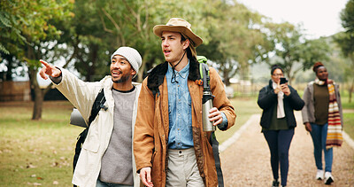 Buy stock photo Pointing, travel and hiking with friends in nature for eco vacation, adventure and weekend break. Trekking, winter holiday and sustainability tourism with people outdoor for explore, talk and trip