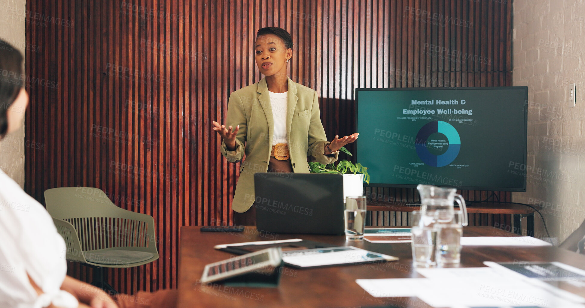Buy stock photo Woman, presentation and mental health at office meeting with discussion, monitor and graphs at hr company. People, speaker and screen with insight, feedback or review with chart for employee wellness