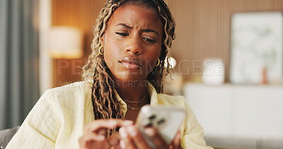 Buy stock photo Confused, reading and phone with black woman on sofa in home for communication, mistake and scam. Contact, online glitch and phishing link with person and mobile in living room of apartment for app