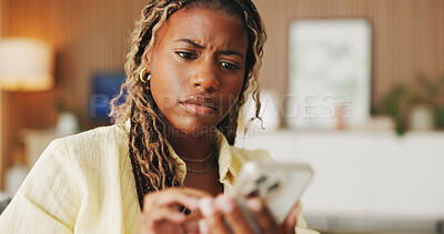 Buy stock photo Worry, typing and phone with black woman on sofa in home for communication, mistake and scam. Contact, online glitch and phishing link with person and mobile in living room of apartment for app