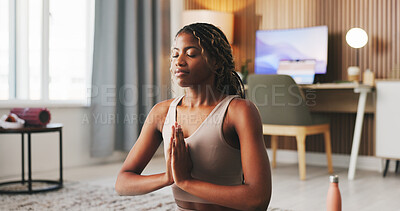 Buy stock photo Woman, peace and yoga in house with meditation, spiritual awareness and self care for holistic health. Zen, black person and mindfulness exercise in lounge with namaste pose, mudra and introspection.