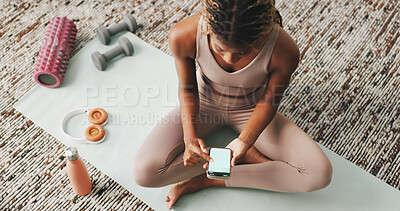Buy stock photo Above, fitness and phone screen with black woman in home for communication, health app and break. Social media, yoga pose search and connection with person in living room of house for wellness