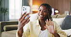 Black woman, phone and smile with video call at house, wave and greeting on web in living room. African person, smartphone and happy with mobile app, talk or virtual contact on social media at home