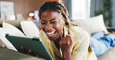 Buy stock photo Fist pump, excited and tablet with black woman on sofa in home for online casino prize, winner and bonus. Connection, jackpot profit and app with person in living room of house for achievement