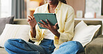 Hands, girl and typing on tablet on sofa for university portal, study registration or research. Student, person and scroll on tech in home for college enrollment, scholarship application or admission