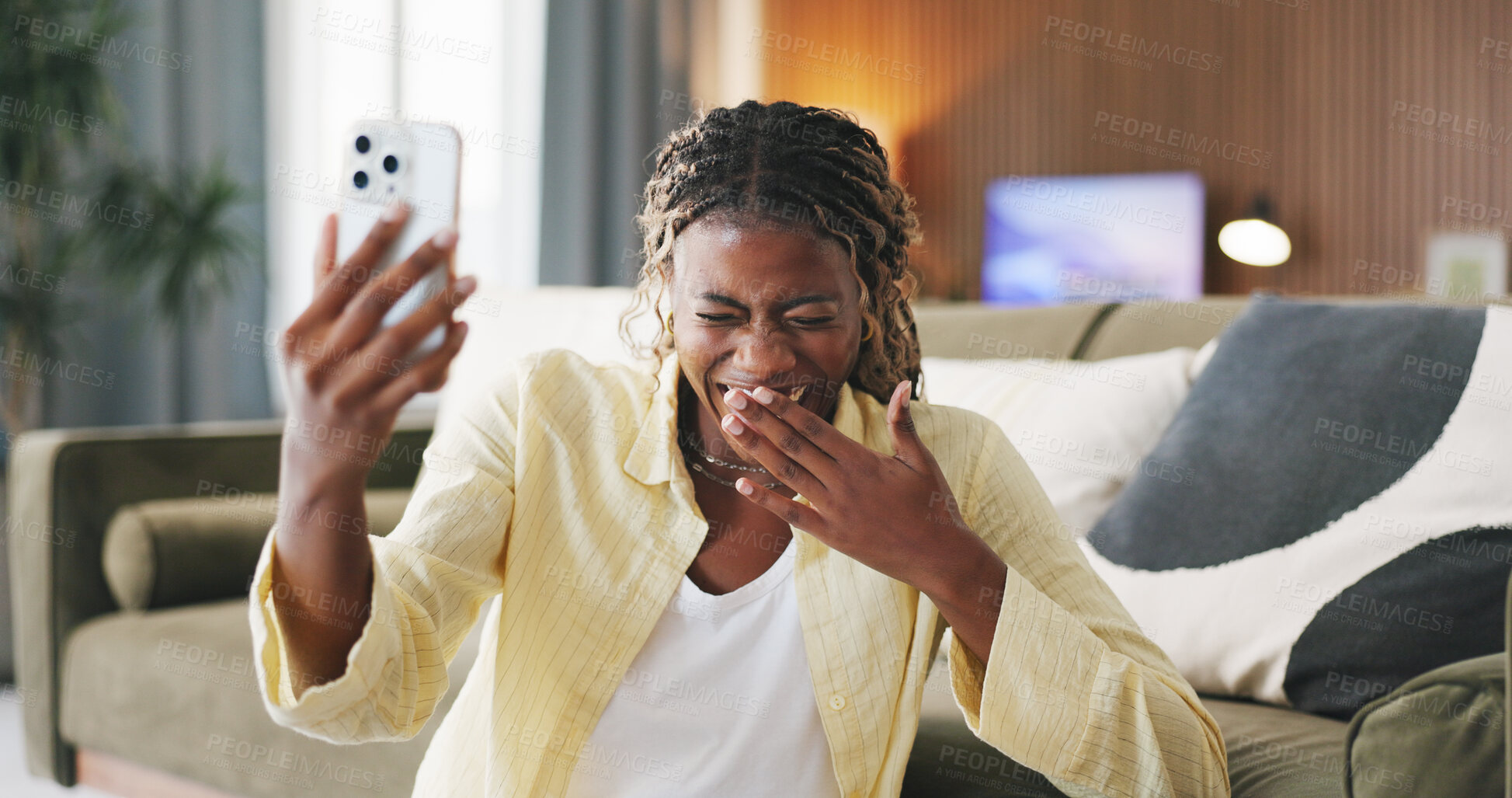 Buy stock photo Black woman, phone and laugh with video call in home, joke and funny story on floor in living room. African person, smartphone and happy with mobile app, talk or virtual chat on social media at house