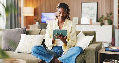 Buy stock photo Smile, home and black woman on couch, tablet for social media and reaction for post. Happiness, tech and African person on sofa, connection for online announcement, internet and text to contact