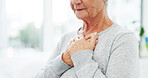 Old woman, chest pain and heartburn in hospital for checkup, visit or healthcare exam. Diagnosis, senior person or infection with virus or symptoms for discomfort, acid reflux or gastro disease