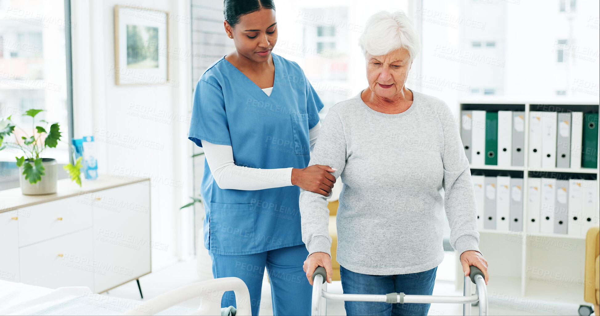 Buy stock photo Senior, woman or nurse with walker for mobility, muscle rehabilitation or assistance in hospital. Caregiver, help or elderly person with a disability or walking aid for support, recovery or stability