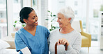 Comfort, hug and nurse with senior woman in hospital for conversation, empathy or support at checkup. Smile, trust and medical caregiver with elderly female patient embracing at consultation.