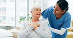 Consultation, nurse and senior woman with chest pain or cardiovascular emergency in hospital. Diagnosis, lung infection and medical worker with elderly patient in clinic for angina or discomfort.