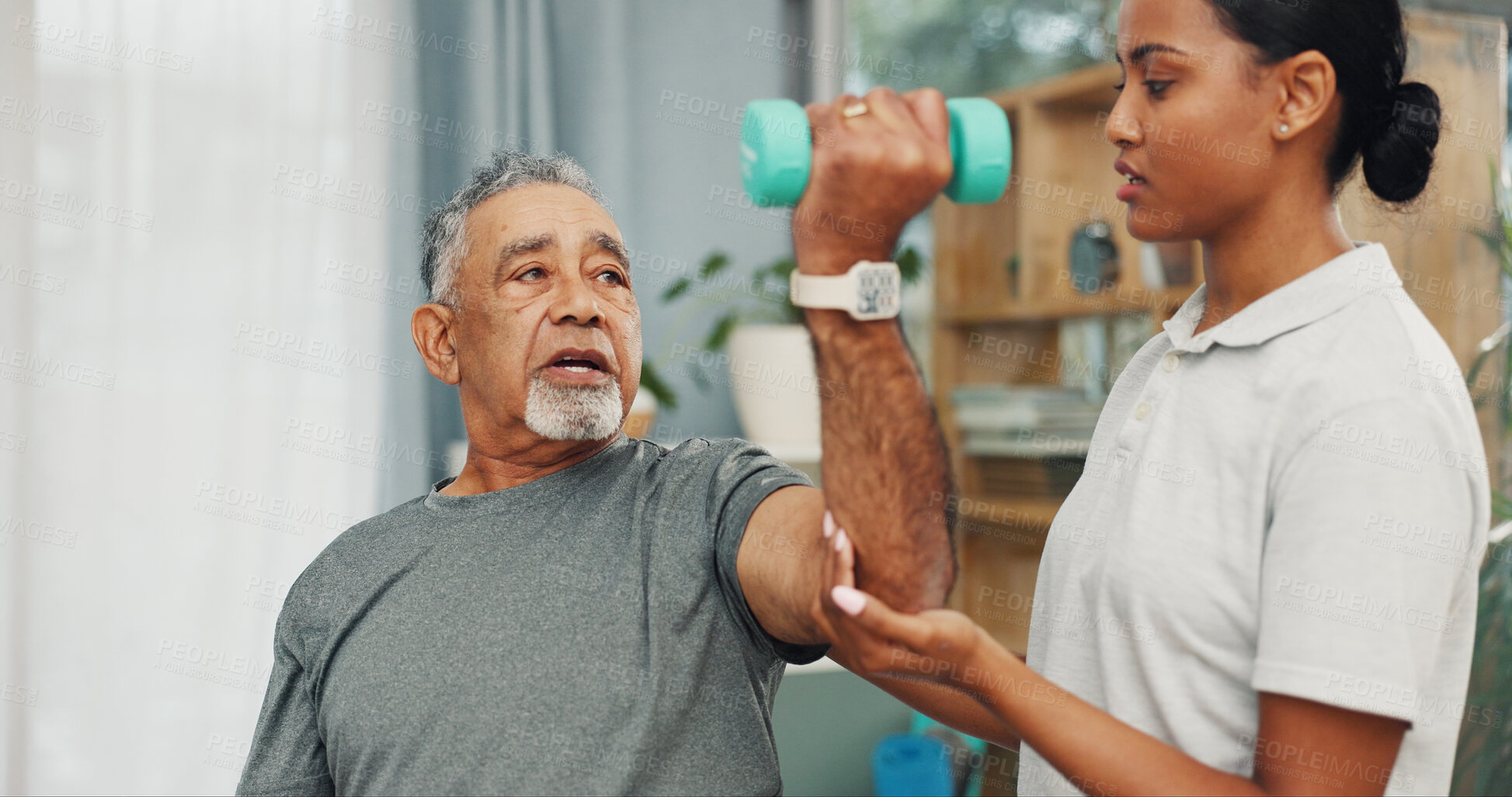 Buy stock photo Clinic, physio and senior man with dumbbells for mobility exercise, rehabilitation and guidance. Health, professional and old patient with weights for physical therapy, arthritis and healing support