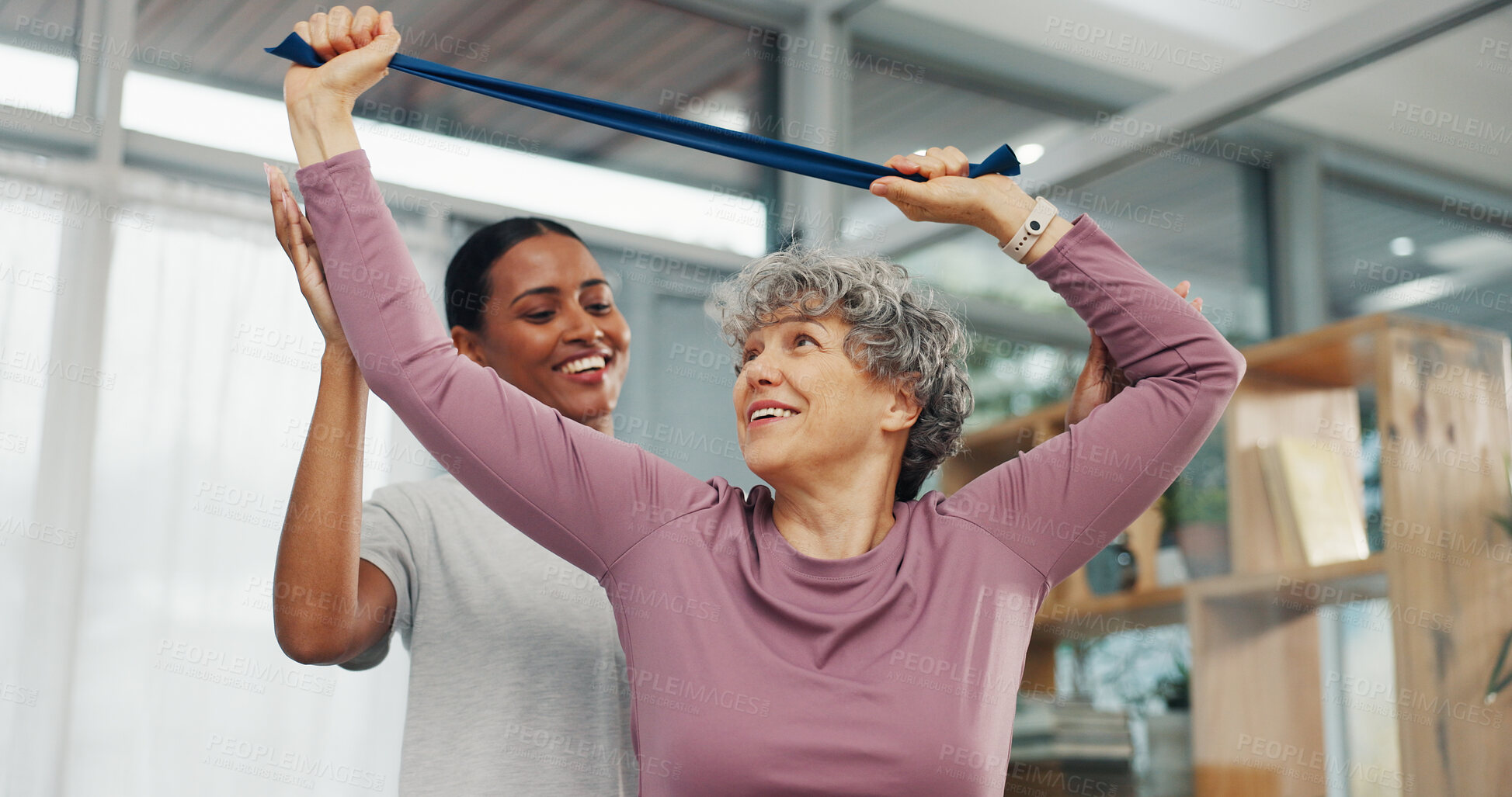 Buy stock photo Clinic, physio and old woman stretching with resistance band for rehabilitation, arthritis or help. Physical therapy, expert and senior patient with exercise for wellness, healing and muscle recovery
