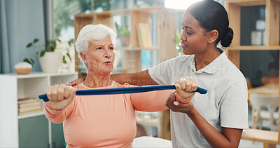 Buy stock photo Old woman, physiotherapist and resistance band at clinic for stretching arms, recovery or muscle wellness. People, smile and guide with rehabilitation for injury, exercise or support in retirement
