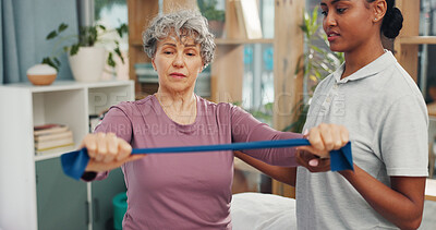 Buy stock photo Old woman, physiotherapist and resistance band at clinic for rehabilitation, recovery or muscle wellness. People, smile and guide with stretching arms for injury, exercise or support in retirement