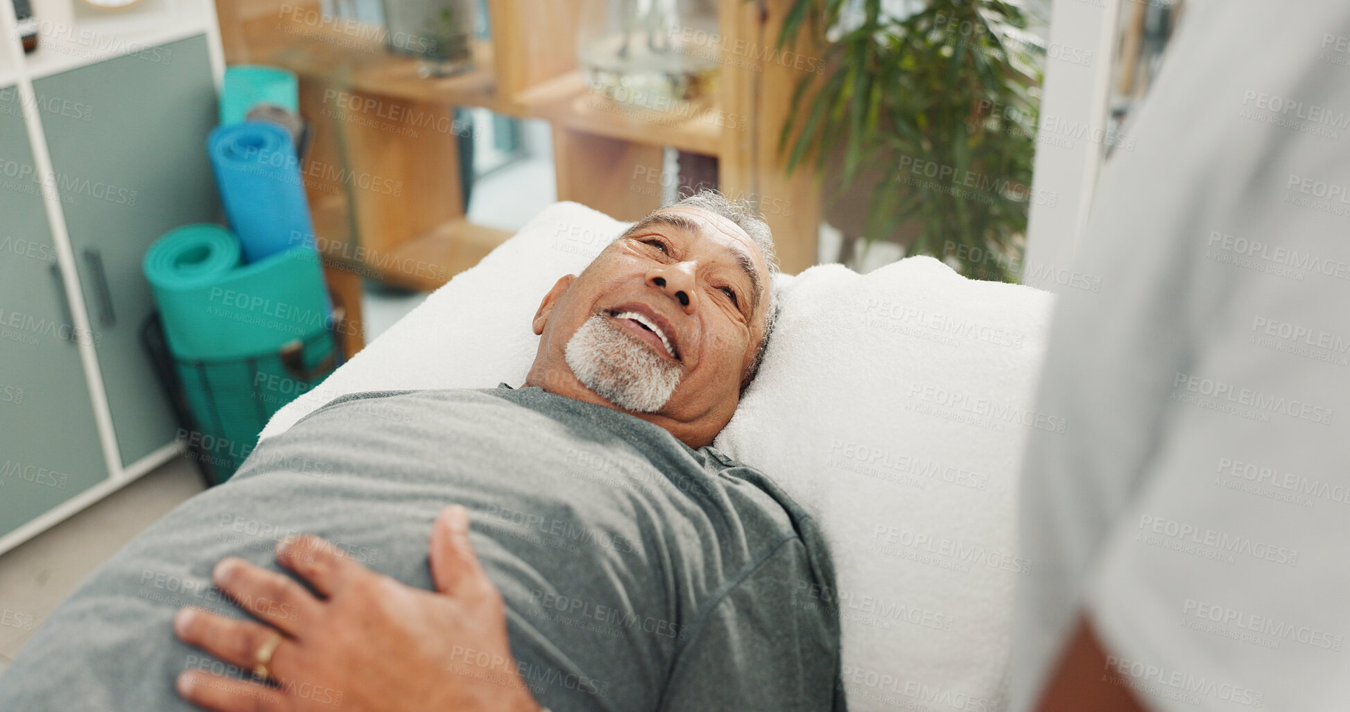 Buy stock photo Consulting, happy and physiotherapy with old man in office for healthcare, rehabilitation and orthopedic help. Physical therapy, chiropractic recovery and checkup with person in clinic for support