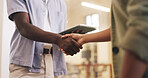 Tablet, handshake and business people in office with b2b agreement, collaboration or marketing deal. Person, client and shaking hands in workplace with tech, teamwork or offer for advertising project