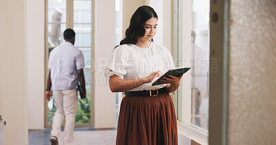 Buy stock photo Review, draft or woman in lobby with tablet, column edit or source feedback for article update. Press, reading or journalist in office with tech, proofreading or industry research for publication.
