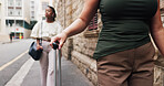 Business, woman and hand in city with luggage, international travel or commute for work conference. Entrepreneur, person and walk in urban town with suitcase, job opportunity or journey to convention