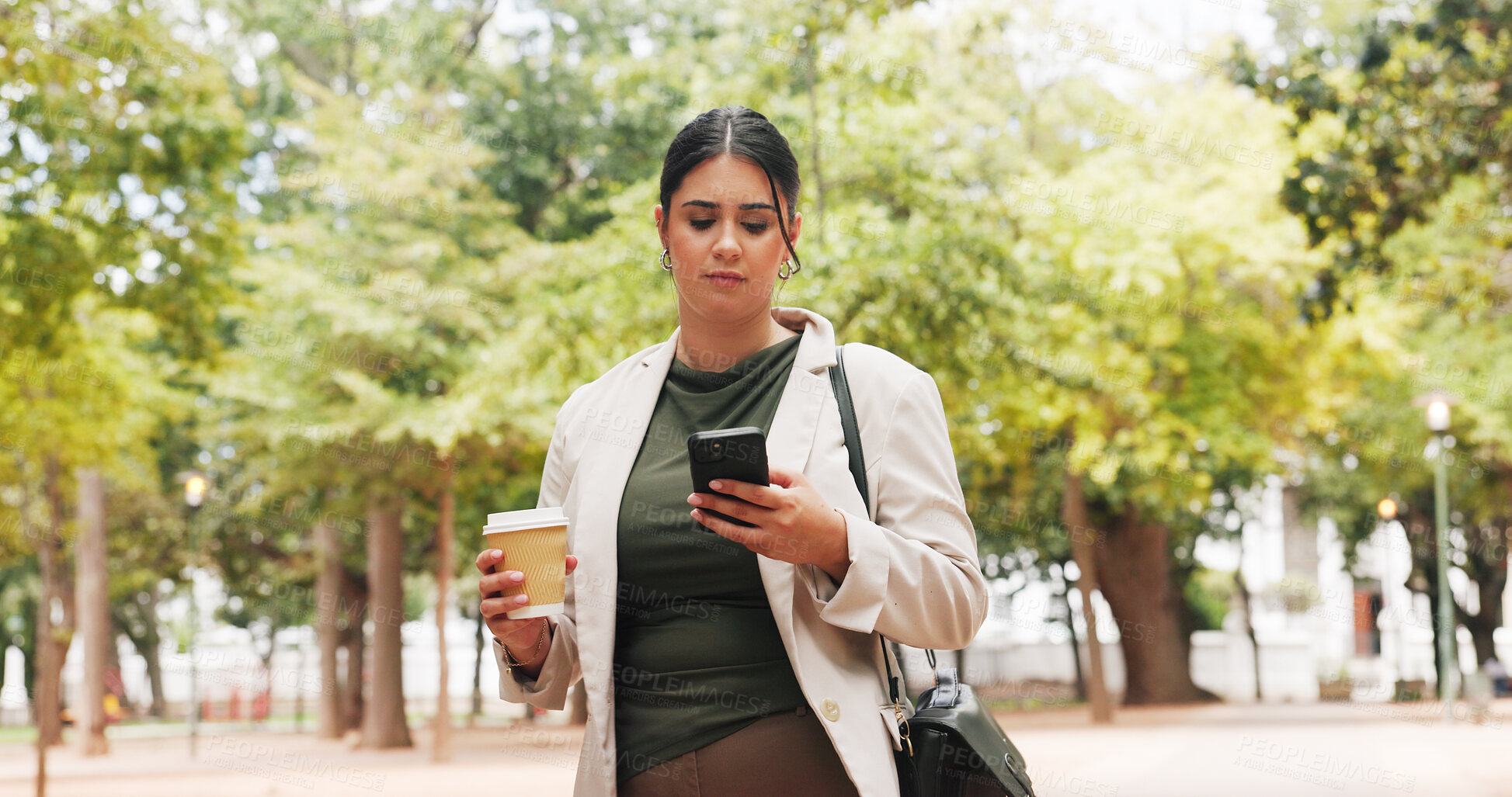 Buy stock photo Businesswoman, commute and coffee in park with phone, public relations job or check for email update. Person, walk or scroll outdoor with tech, review press release and drink for travel to PR agency.