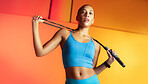 Fitness, jump rope and portrait of woman in studio for workout, cardio challenge and health. Skipping equipment, wellness and training with low angle of person on orange background for exercise