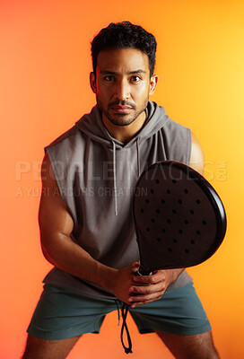 Buy stock photo Ready, racket and padel with portrait of man for serve, sports athlete and fitness practice. Competition tournament, tennis match challenge and training with person on studio background for exercise