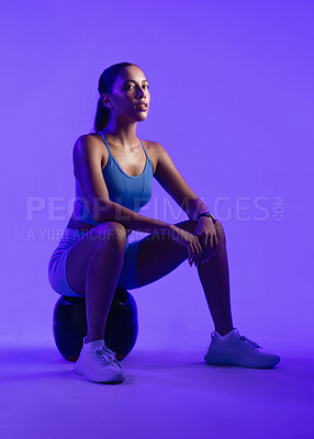 Buy stock photo Woman, fitness and medicine ball in studio with portrait, confidence and rest on purple background. Person, balance and training with pride, exercise and muscle development for wellness in Mexico