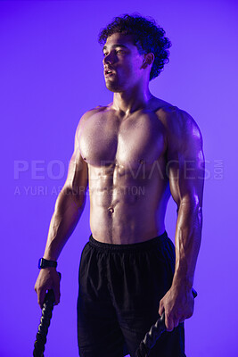 Buy stock photo Man, battle rope and exhausted in studio for training, muscle or thinking with break on purple background. Person, tired and sweat with workout, exercise and cord with perspective for cardio wellness