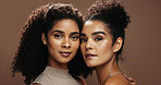 Portrait, skincare and women with confidence in studio, natural cosmetics and support for wellness glow. Dermatology, friends and people with self care for facial shine, beauty and brown background