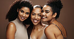 Portrait, skincare and women in studio with beauty community, bonding together and makeup aesthetic. Happy, female friends and dermatology with glowing skin, support and wellness on brown background.