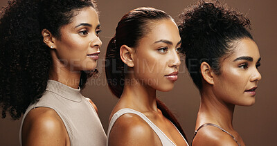 Buy stock photo Women, skincare and makeup in studio for cosmetics, empowerment or inclusion on a brown background. Female people, model or glow up in row with shine for beauty, cosmetology or dermatology together
