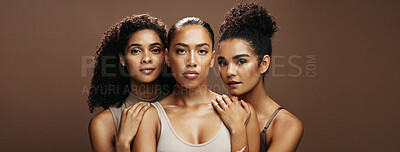 Buy stock photo Portrait, women and confident with makeup in studio for beauty, natural glow and inclusion. Serious, people and friends with banner, facial cosmetics and solidarity for aesthetic on brown background