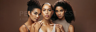 Buy stock photo Portrait, women and serious with makeup in studio for beauty, natural glow and inclusion. Confident, people and friends with banner, facial cosmetics and solidarity for aesthetic on brown background