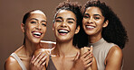 Laughing, portrait and women with makeup for beauty, group and self care with cosmetics for wellness. Studio background, humor and people with smile for skincare, embrace and dermatology in Brazil