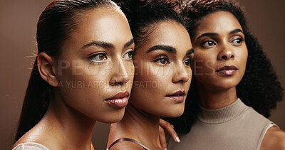 Buy stock photo Women, skincare or thinking with makeup for beauty, spa or salon together on a brown background. Female people, model or glow up in row or line with shine or empowerment for cosmetics or cosmetology