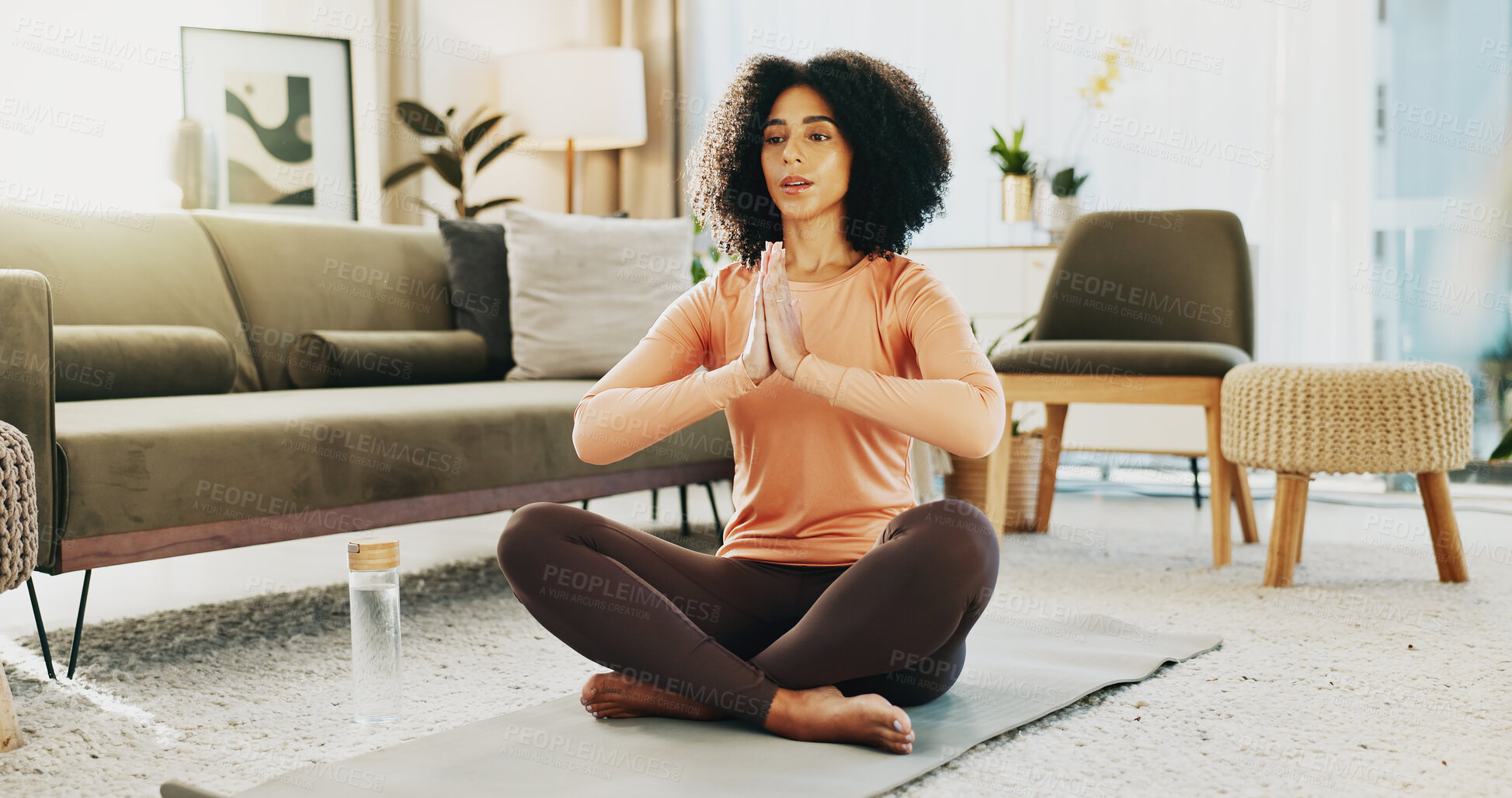 Buy stock photo Prayer hands, meditation and woman in home for wellness, peace and health in morning for balance. Calm, namaste and female person with yoga pose for relax, zen or mindfulness in living room at house.