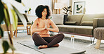 Prayer hands, meditation and woman in home for calm, peace and health in morning for balance. Wellness, namaste and female person with yoga pose for relax, zen or mindfulness in living room at house.