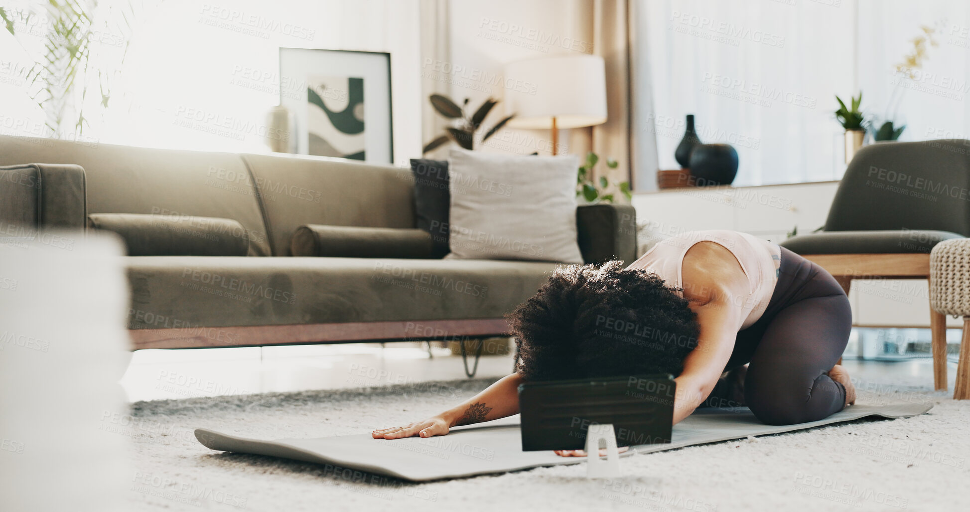 Buy stock photo Woman, yoga mat and tablet in home for stretching, tutorial or online course for childs pose on floor. Person, smile and tech for virtual class, fitness or streaming subscription on app at apartment