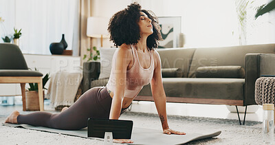 Buy stock photo Yoga, stretching and woman with tablet on floor, breathe and endurance for wellness routine in house. Self care, activity and person with balance for cobra pose, healthy and tech for fitness video