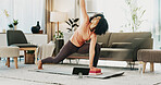 Woman, yoga and block in home with tablet, online class and stretching for holistic health on floor. Fitness, person and balance exercise in living room with lunge, pilates or tech for video tutorial