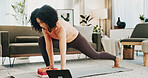 Woman, yoga and block in house with tablet, online class or stretching for holistic health on floor. Fitness, person and balance exercise in living room with lunge, pilates or tech for video tutorial