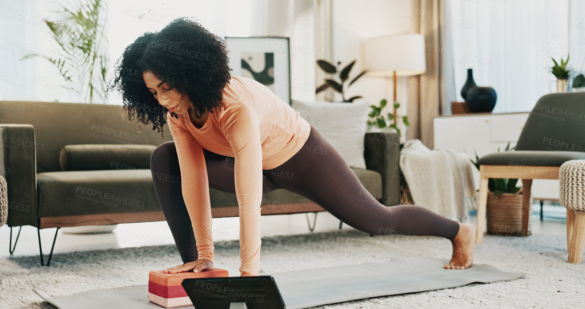 Buy stock photo Woman, yoga and block in house with tablet, online class or stretching for holistic health on floor. Fitness, person and balance exercise in living room with lunge, pilates or tech for video tutorial