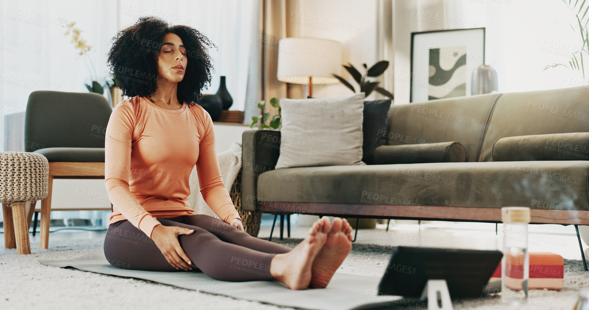 Buy stock photo Woman, yoga mat and tablet in home for wellness, tutorial or online course for holistic fitness on floor. Person, tech and virtual class for breathing exercise, streaming subscription or app at house