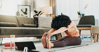 Buy stock photo Woman, yoga and stretching in living room with tablet, wellness and online class for holistic health. Active, person and warm up in home with pilates preparation, fitness and tech for video tutorial.