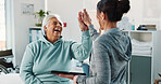 Old woman, physiotherapist and tablet with high five at clinic in consultation, excited and support. People, healthcare professional and tech with goals, success and rehabilitation for recovery