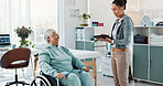 Physiotherapist, tablet and old woman in clinic with wheelchair, discussion or good news for healing. Healthcare worker, tech and senior person with disability, smile or feedback for physical therapy